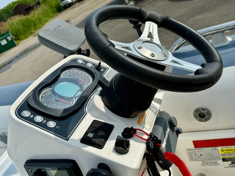 Slide: The Image of 2019 Williams Jet Tenders Sportjet 395 dashboard with steering wheel and control panel. - 35