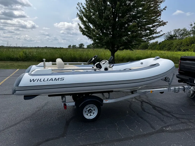 Slide: The Image of 2019 Williams Jet Tenders Sportjet 395 on trailer, parked outdoors. - 7