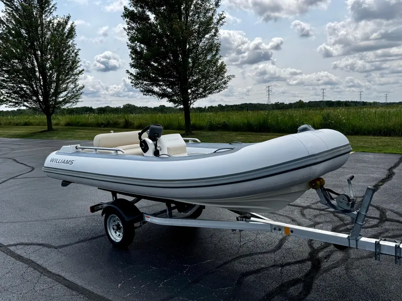 Slide: The Image of 2019 Williams Jet Tenders Sportjet 395 on trailer, parked outdoors. - 8