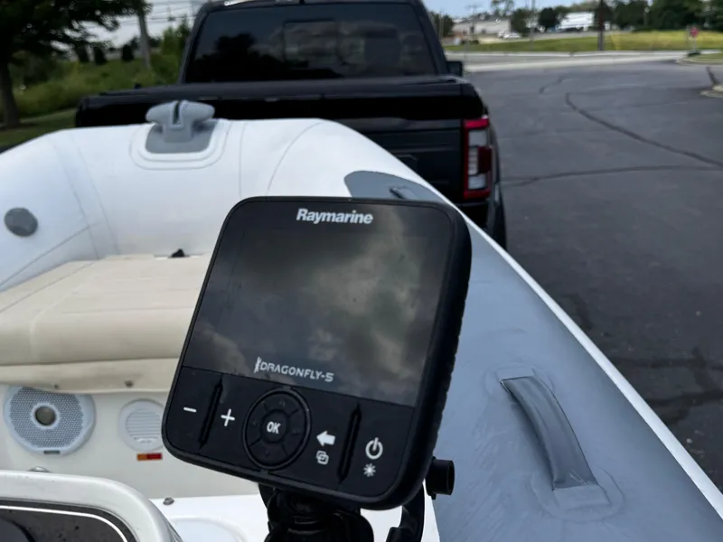 Slide: The Image of 2019 Williams Jet Tenders Sportjet 395 with Raymarine Dragonfly-5 display, parked near a truck. - 9