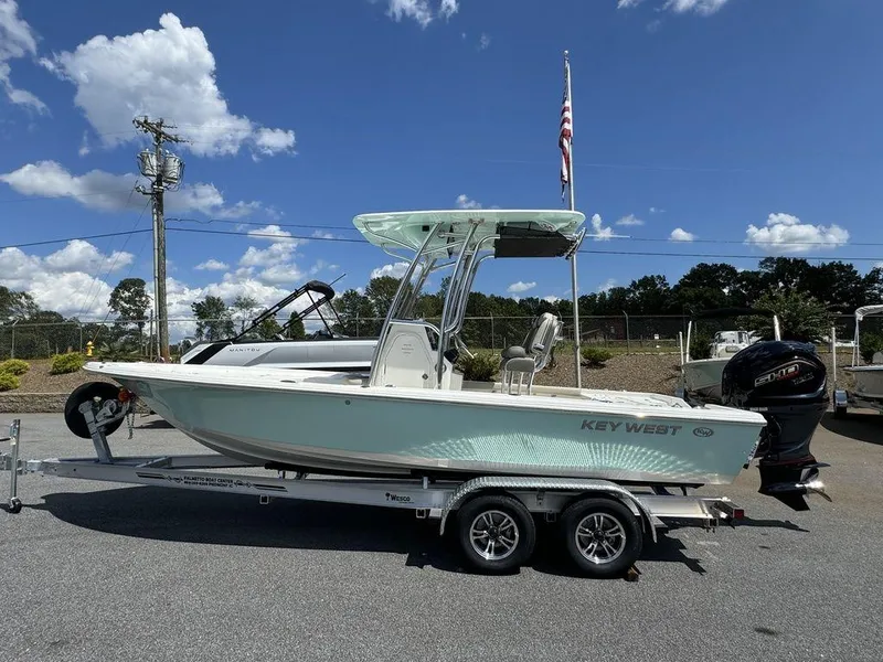 The Image of 2025 Key West 230 BR boat on trailer under blue sky. - 0