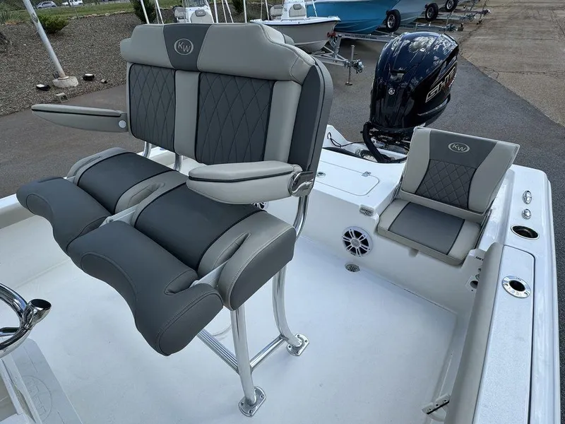 Slide: The Image of 2025 Key West 230 BR boat interior with gray seating and modern design. - 17