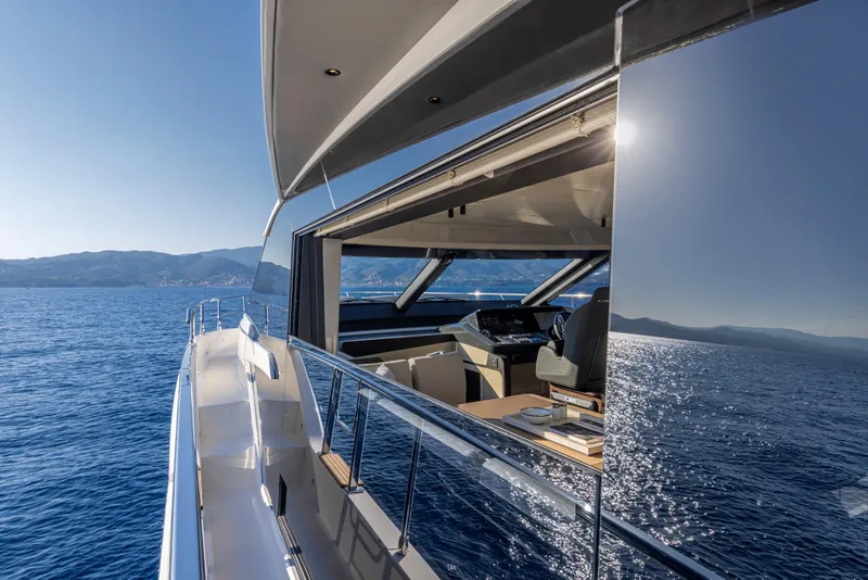 Slide: The Image of Luxury Absolute 56 FLY yacht cruising on open sea, 2025 model. - 13