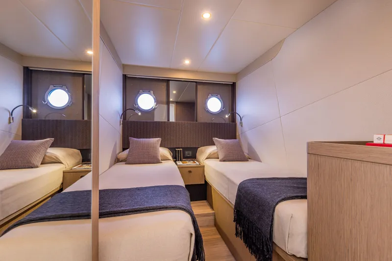 Slide: The Image of Luxurious twin cabin on 2025 Absolute 56 FLY yacht with modern decor. - 24