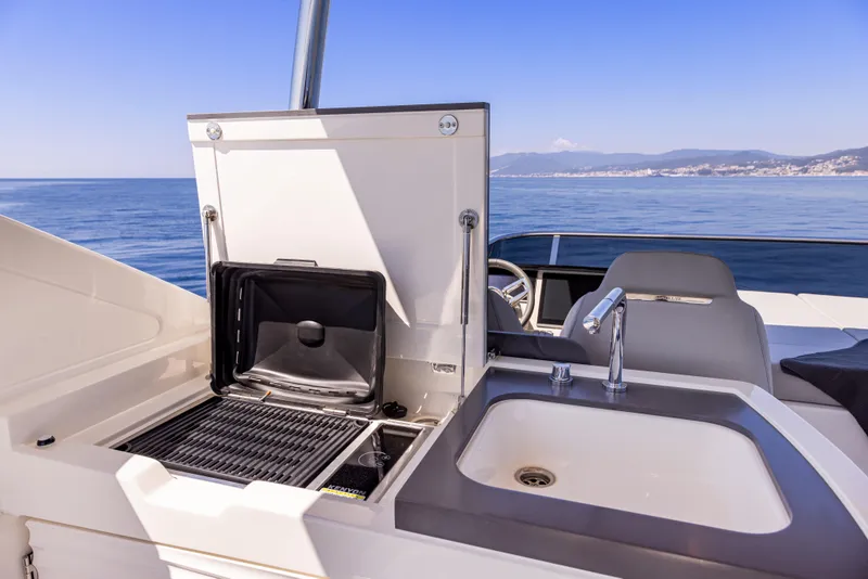Slide: The Image of Luxury yacht Absolute 56 FLY 2025 with outdoor kitchen and sink, ocean view. - 6