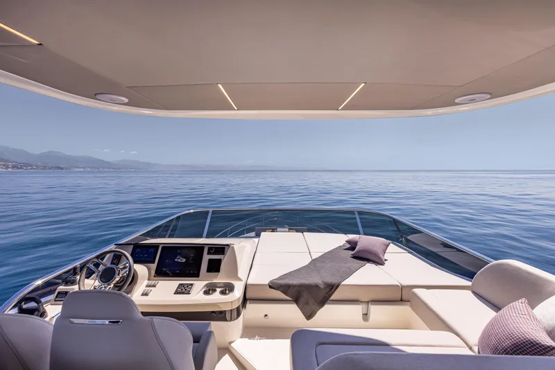 Slide: The Image of Luxury Absolute 56 FLY yacht interior, 2025 model, with ocean view and modern design. - 7