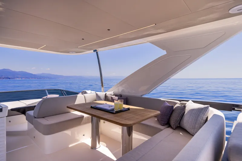 Slide: The Image of Luxurious seating area on 2025 Absolute 56 FLY yacht with ocean view. - 8