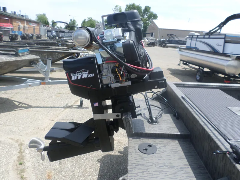 Slide: The Image of 2024 GATOR-TAIL 1860 Extreme CC boat motor in outdoor setting. - 2