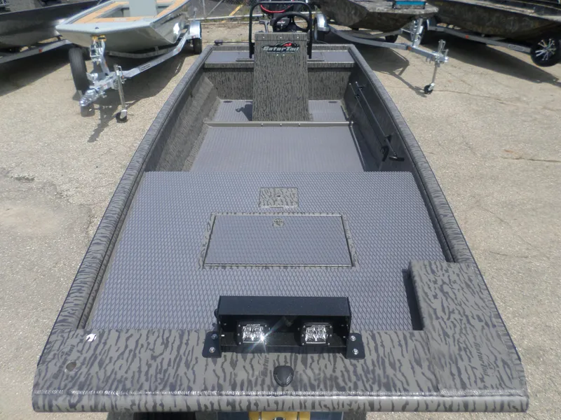 Slide: The Image of 2024 GATOR-TAIL 1860 Extreme CC boat, camo design, parked on trailer. - 3