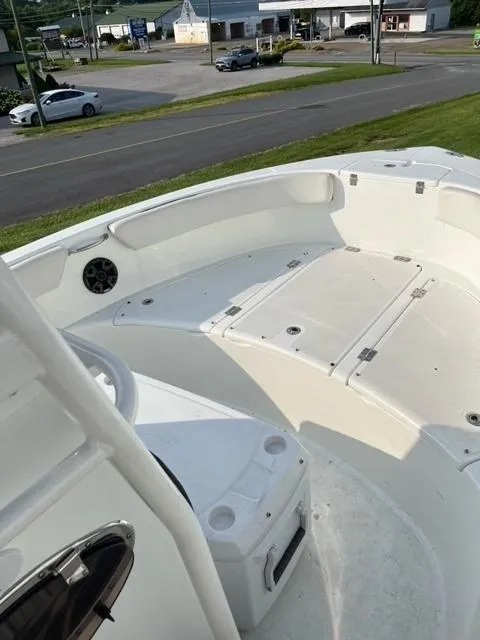 Slide: The Image of 2016 Clearwater 2200 WI Center Console boat interior with seating and storage compartments. - 7