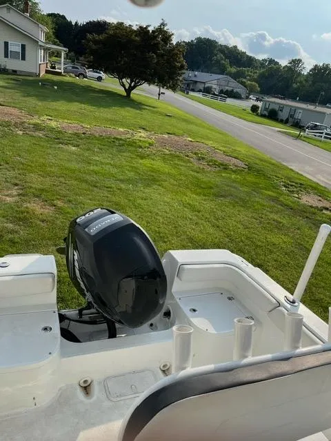 Slide: The Image of 2016 Clearwater 2200 WI Center Console boat with outboard motor on grassy lawn. - 8