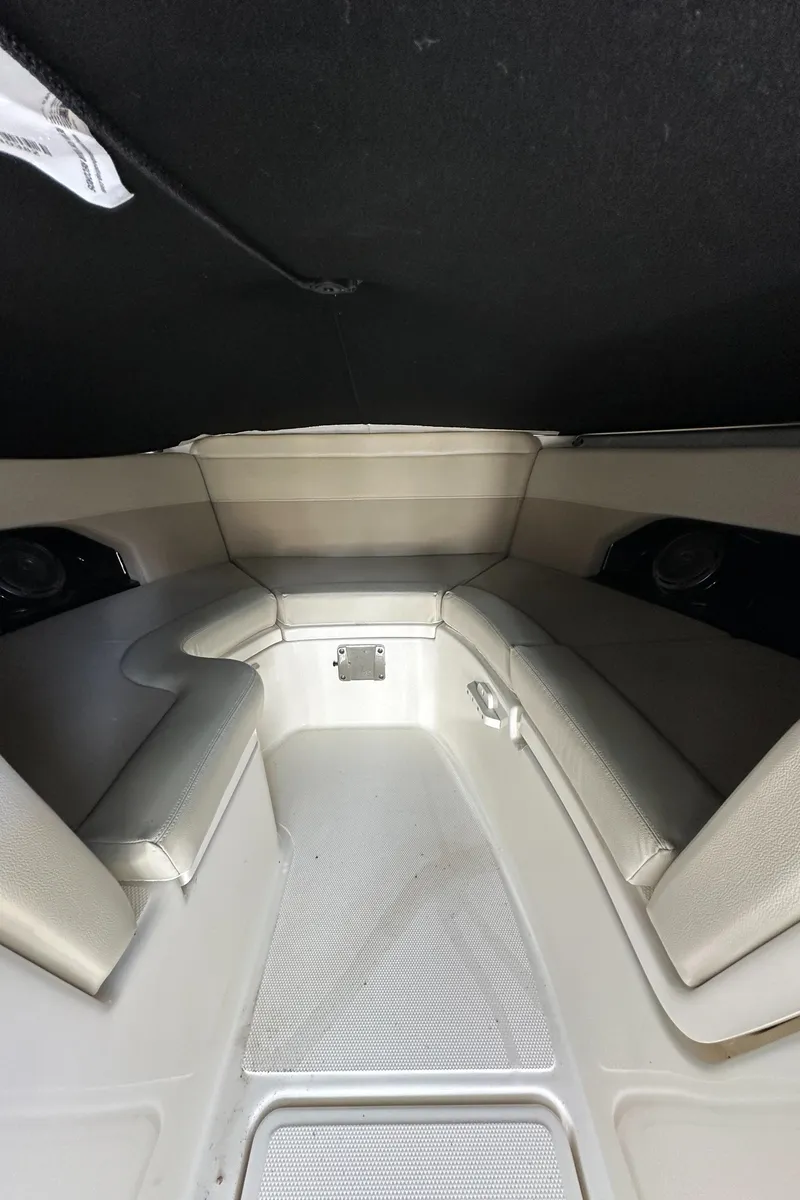 Slide: The Image of Interior of a 2021 Boston Whaler 240 Vantage boat, featuring cushioned seating. - 13