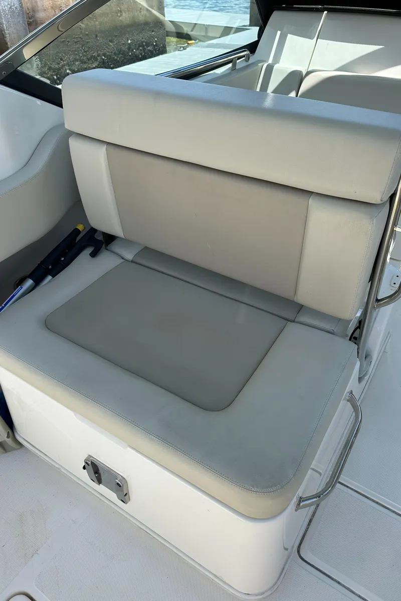 Slide: The Image of 2021 Boston Whaler 240 Vantage boat seat, featuring light gray upholstery. - 18
