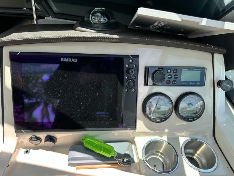 Slide: The Image of Control panel of a 2021 Boston Whaler 240 Vantage boat with Simrad display. - 8
