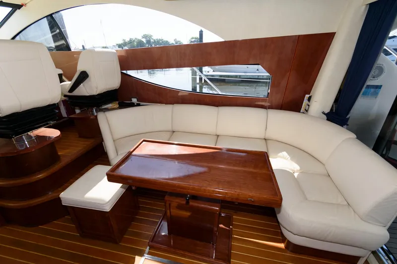 Slide: The Image of Luxurious interior of 2007 Fairline Phantom 46 yacht with elegant seating and wooden table. - 15