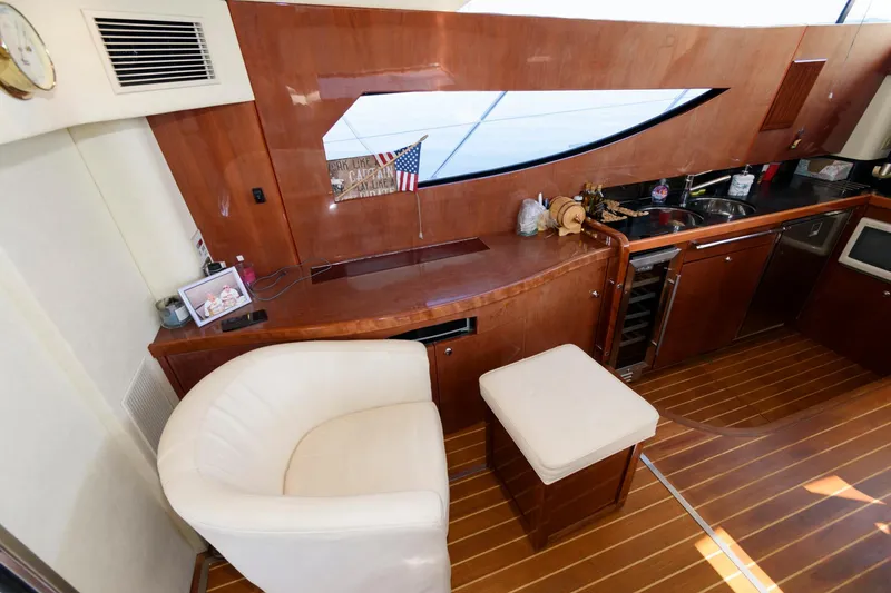 Slide: The Image of Interior of 2007 Fairline Phantom 46 yacht with wooden finishes and modern amenities. - 16