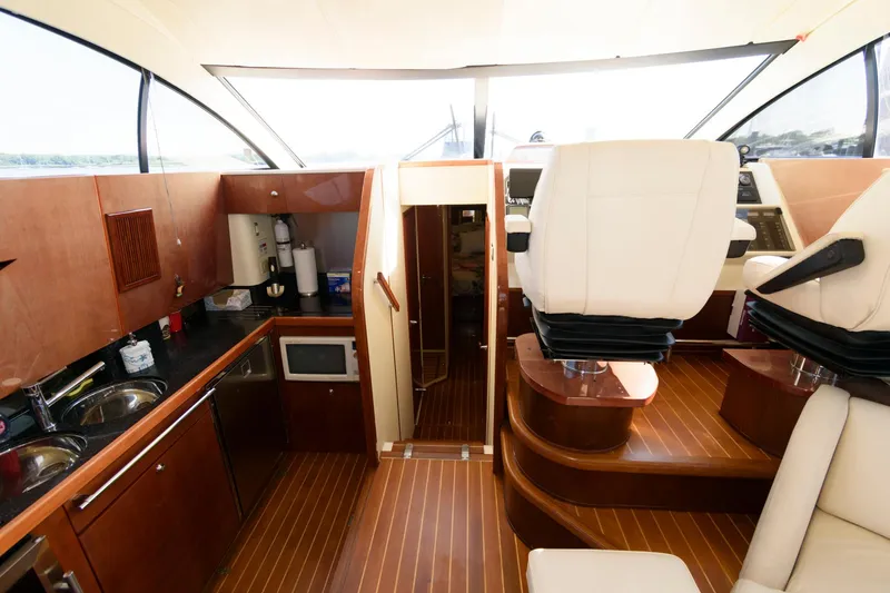 Slide: The Image of Interior of 2007 Fairline Phantom 46 yacht with modern kitchen and seating area. - 17