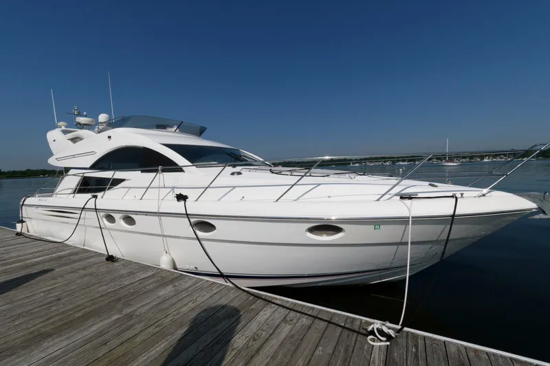 Slide: The Image of 2007 Fairline Phantom 46 yacht docked on a sunny day. - 2