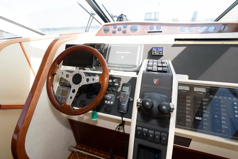 Slide: The Image of Control panel of 2007 Fairline Phantom 46 yacht with steering wheel and navigation equipment. - 21