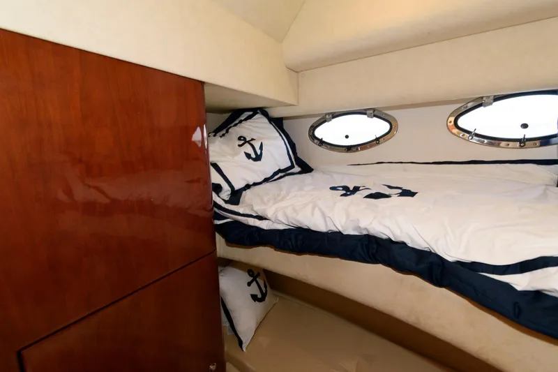 Slide: The Image of Luxurious cabin interior of 2007 Fairline Phantom 46 yacht with nautical-themed bedding. - 26