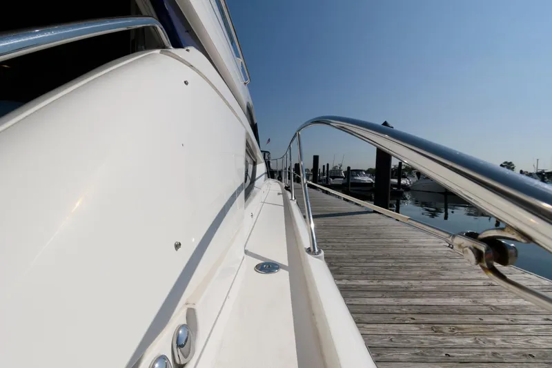 Slide: The Image of Side view of 2007 Fairline Phantom 46 yacht docked at marina. - 3