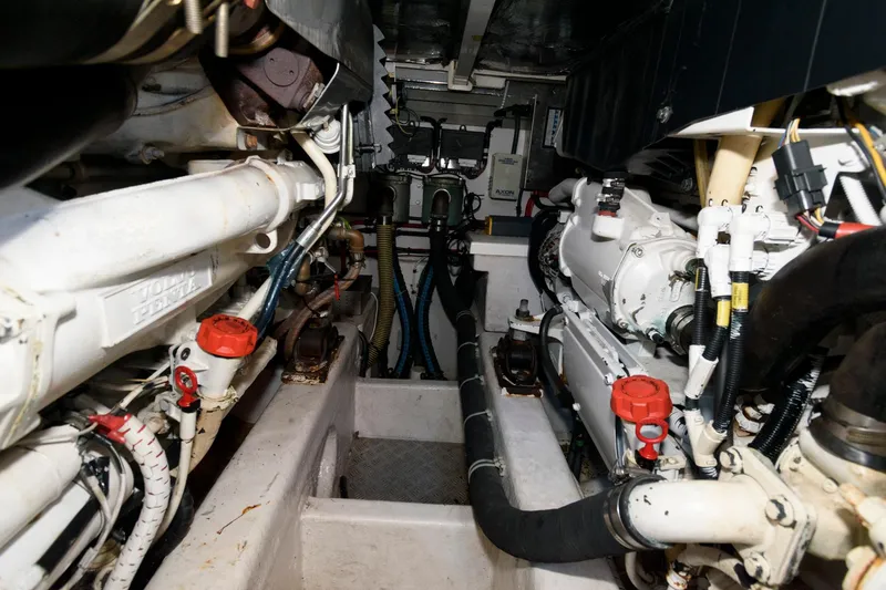 Slide: The Image of Engine room of a 2007 Fairline Phantom 46 yacht, showcasing mechanical components. - 31