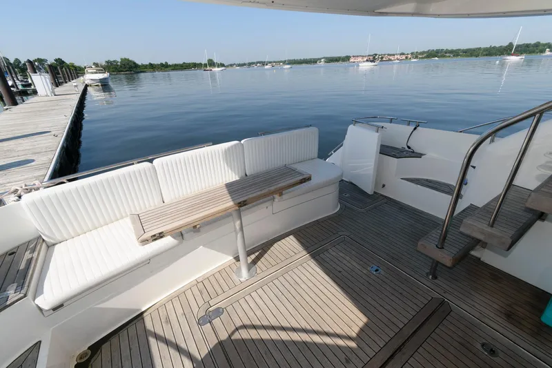 Slide: The Image of 2007 Fairline Phantom 46 yacht deck with seating, table, and waterfront view. - 7