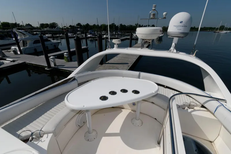 Slide: The Image of 2007 Fairline Phantom 46 yacht with seating area and table at marina. - 8