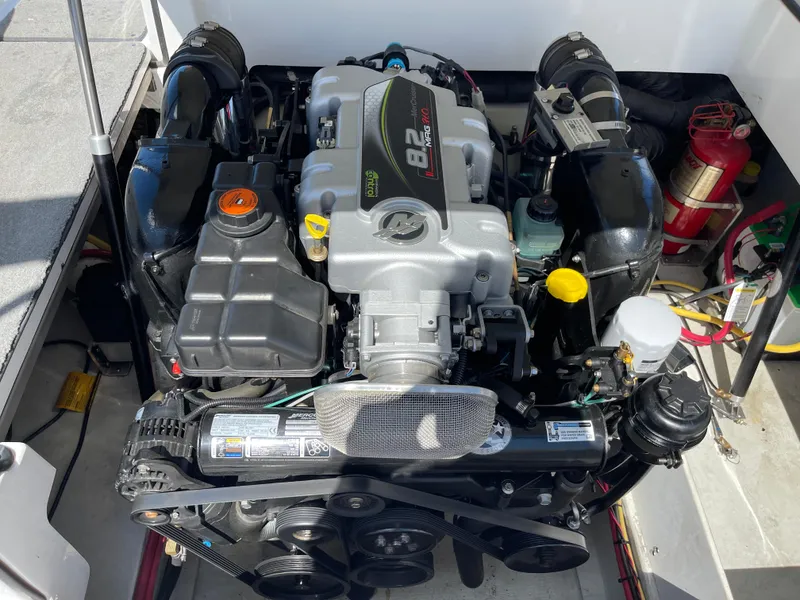 Slide: The Image of Engine compartment of a 2011 Cobalt A25 boat, featuring a powerful 8.2L engine. - 22