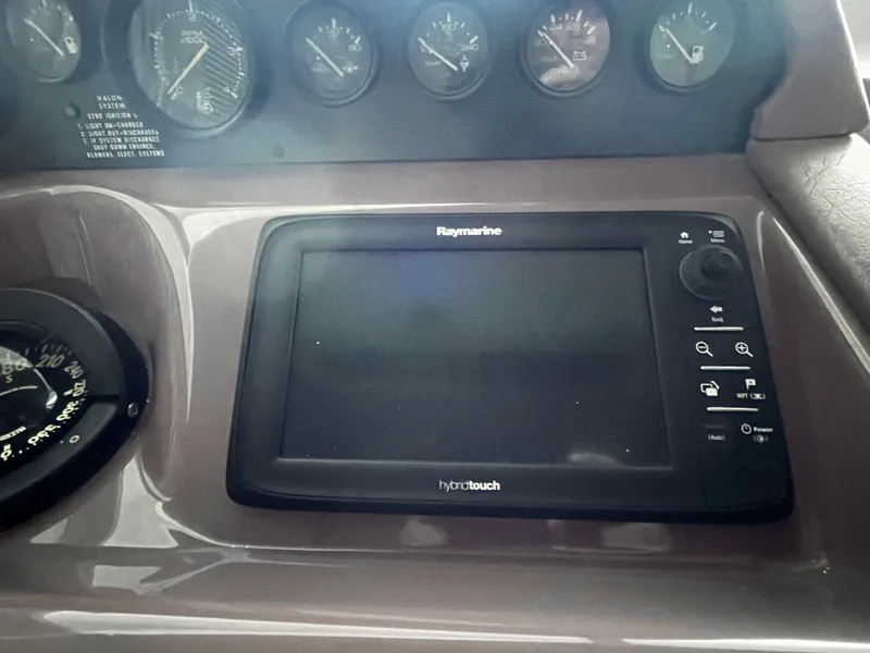 Slide: The Image of Dashboard of a 1990 Sea Ray Sedan Bridge 500 with Raymarine hybrid touch display. - 15