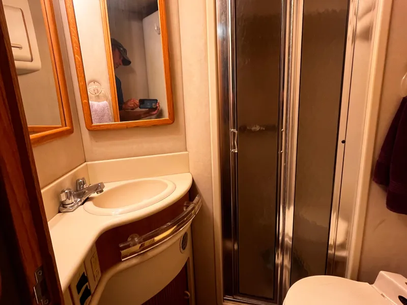 Slide: The Image of Bathroom interior of 1990 Sea Ray Sedan Bridge 500 yacht with shower and sink. - 26