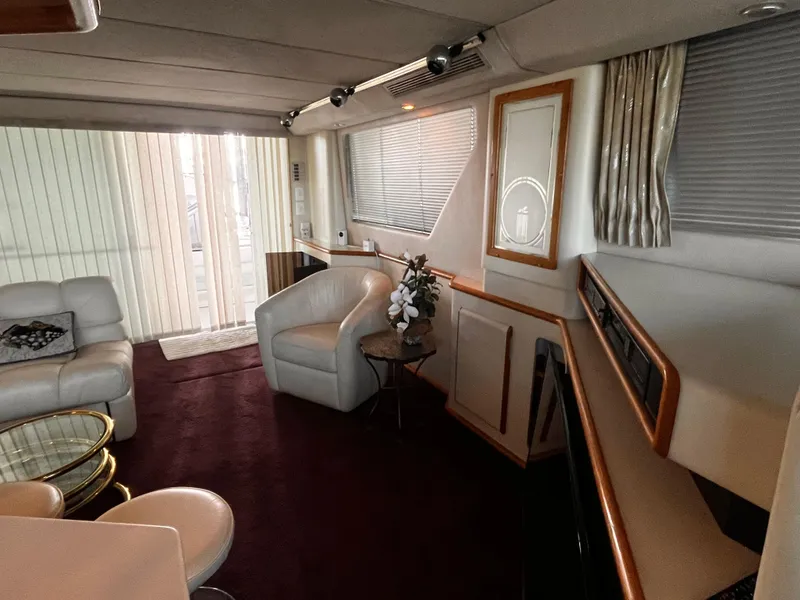 Slide: The Image of Luxurious interior of 1990 Sea Ray Sedan Bridge 500 yacht with elegant seating and decor. - 30