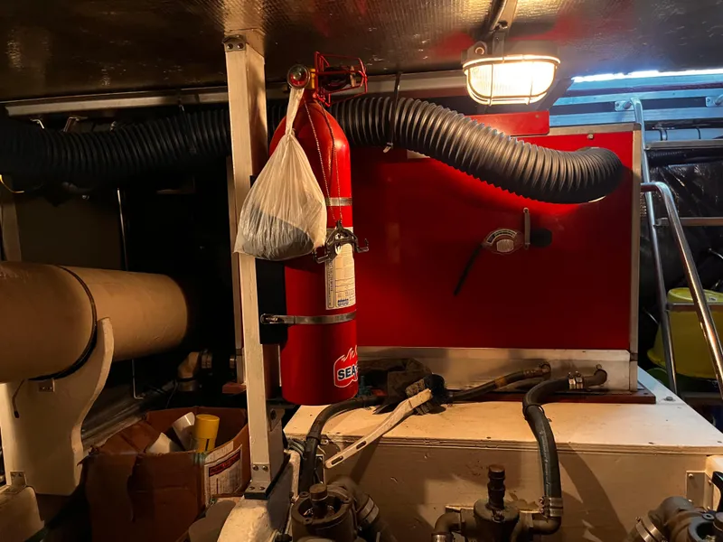 Slide: The Image of Engine room of 1990 Sea Ray Sedan Bridge 500 with fire extinguisher and ventilation system. - 35