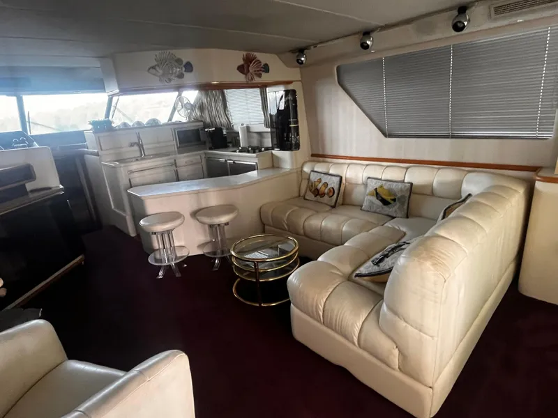 Slide: The Image of Luxurious interior of 1990 Sea Ray Sedan Bridge 500 yacht with plush seating. - 6