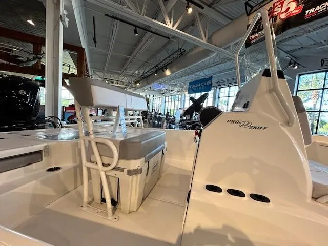 Slide: The Image of 2023 Mako Pro Skiff 19 CC boat interior at a showroom display. - 6