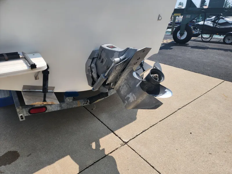 Slide: The Image of Seaswirl Striper 2600 Walkaround I/O 2000 boat stern with propeller and trailer. - 2
