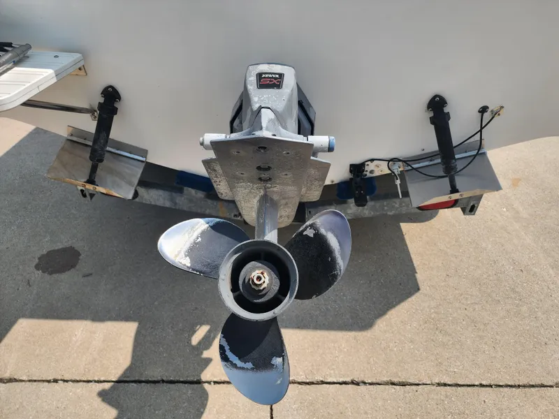 Slide: The Image of Propeller of 2000 Seaswirl Striper 2600 Walkaround I/O boat on concrete surface. - 3