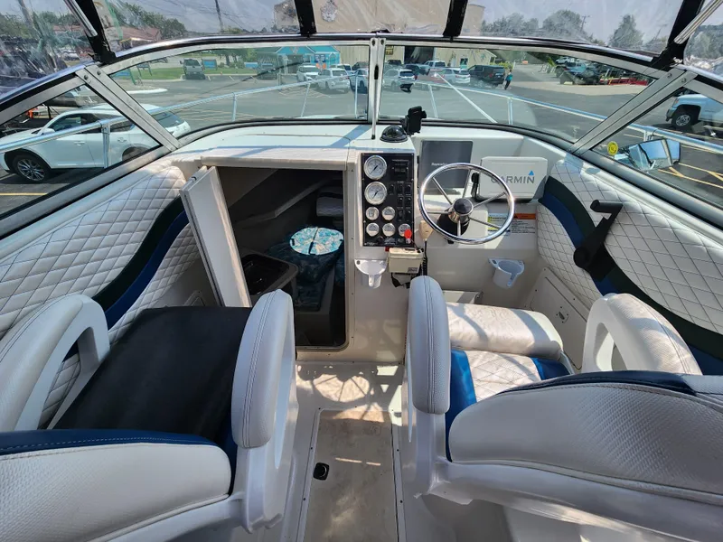 Slide: The Image of Interior of 2000 Seaswirl Striper 2600 Walkaround I/O boat with steering wheel and seating. - 9