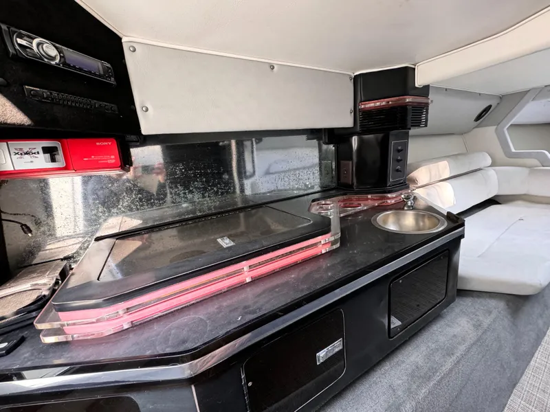 Slide: The Image of Interior of 1990 Fountain 42 Lightning boat with kitchenette and seating area. - 28