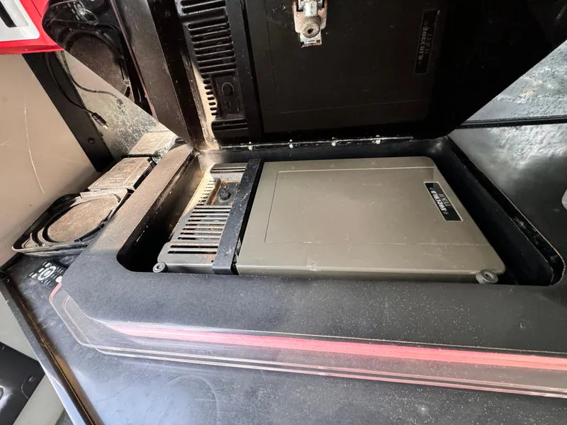 Slide: The Image of 1990 Fountain 42 Lightning engine compartment with visible components and wiring. - 30