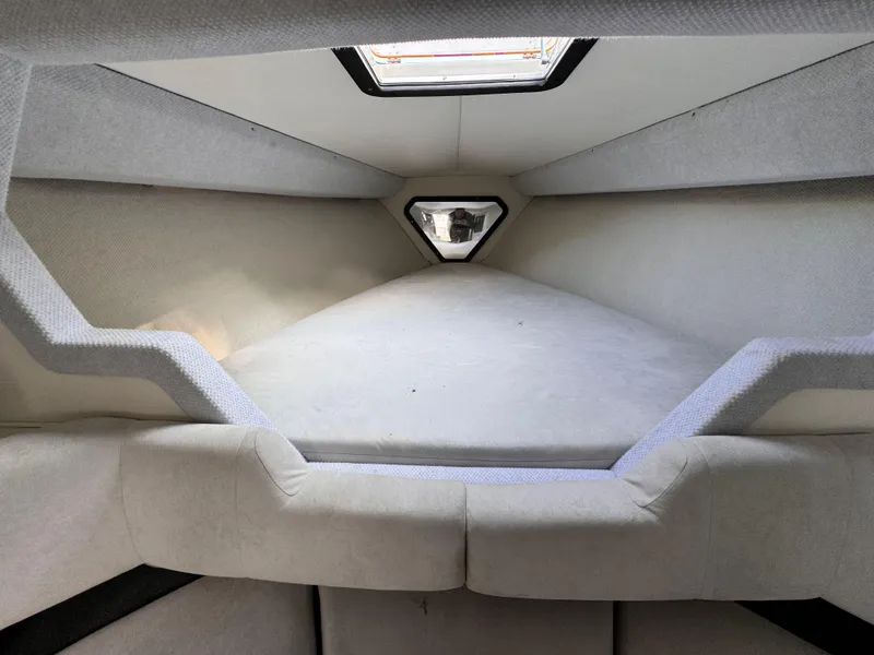 Slide: The Image of Interior cabin of 1990 Fountain 42 Lightning boat, featuring a spacious sleeping area. - 32