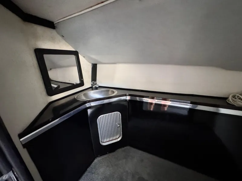 Slide: The Image of Interior of 1990 Fountain 42 Lightning boat with sink and mirror. - 35