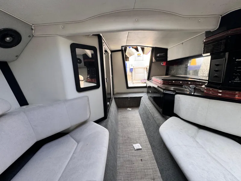 Slide: The Image of Interior of a 1990 Fountain 42 Lightning boat with seating and kitchenette. - 36