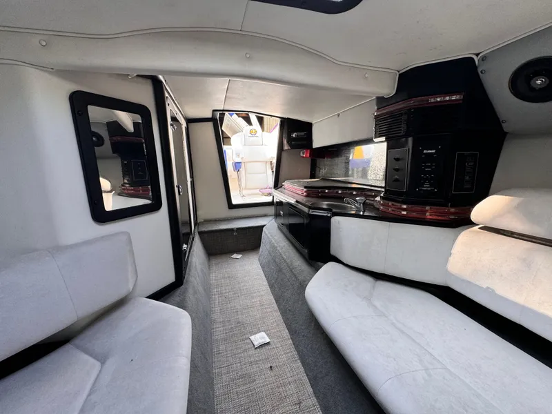 Slide: The Image of Interior of 1990 Fountain 42 Lightning boat, featuring seating and modern amenities. - 37