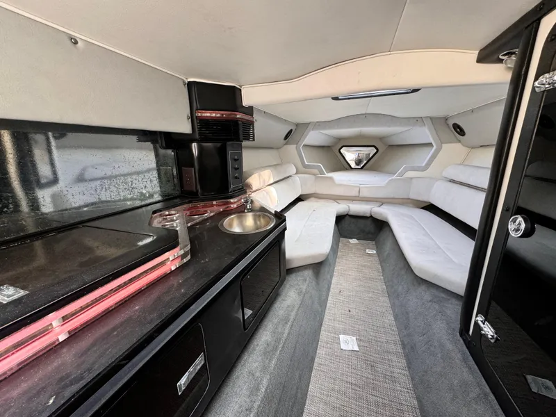 Slide: The Image of Interior of a 1990 Fountain 42 Lightning boat with modern amenities and seating. - 38