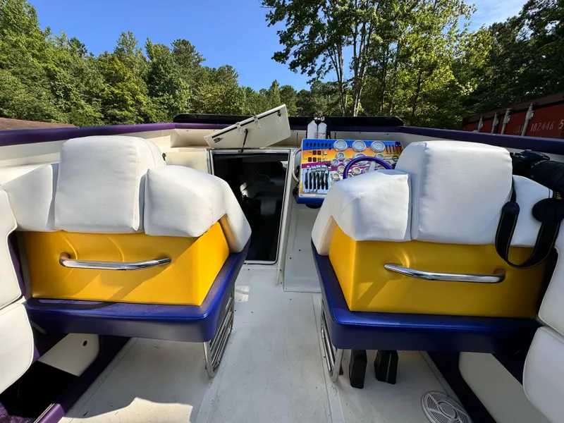 Slide: The Image of Interior of 1990 Fountain 42 Lightning boat with colorful seating and dashboard. - 43