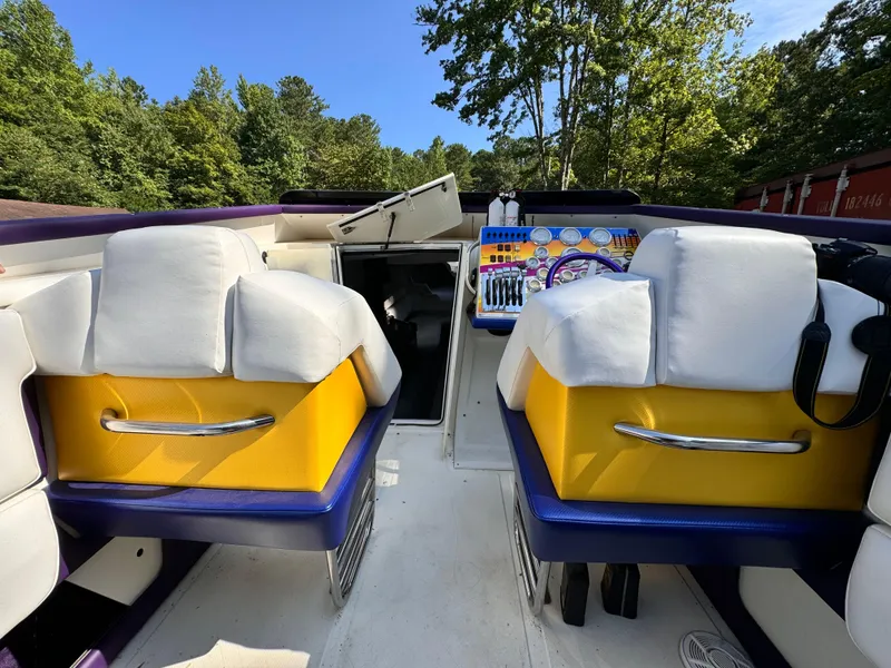 Slide: The Image of Interior of a 1990 Fountain 42 Lightning boat with colorful seating and dashboard. - 44