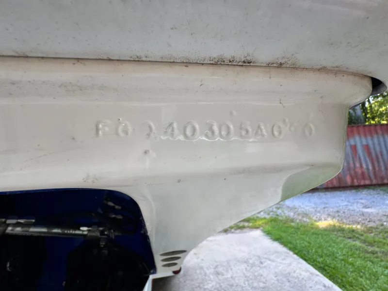 Slide: The Image of 1990 Fountain 42 Lightning boat hull with visible serial number. - 49