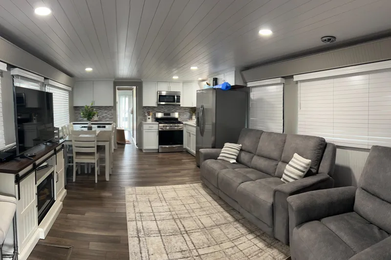 Slide: The Image of Modern interior of 2004 Majestic houseboat with kitchen, dining area, and cozy seating. - 22