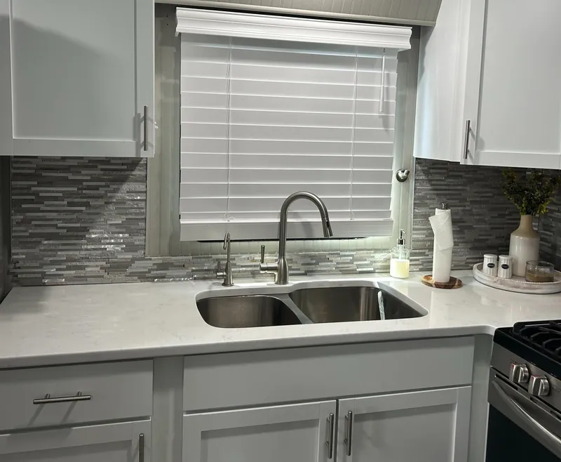 Slide: The Image of Modern kitchen in 2004 Majestic Houseboat with dual sink and sleek backsplash. - 24